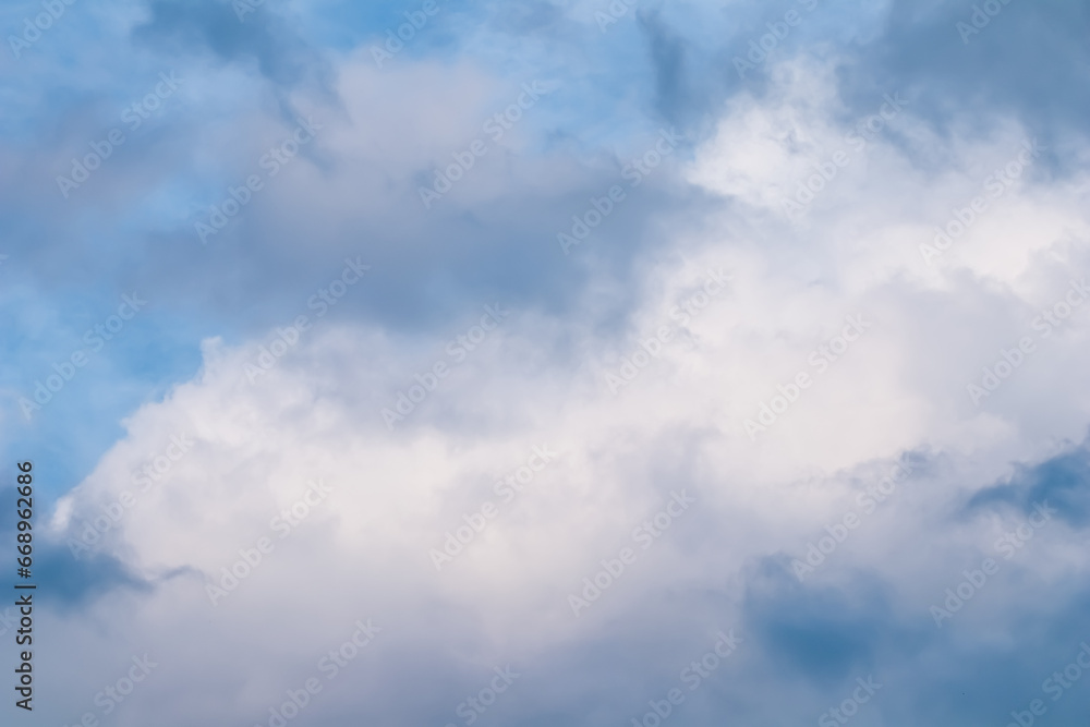 Blue sky background with white and pink clouds at sunset Blue sky background with white and pink clouds at sunset
