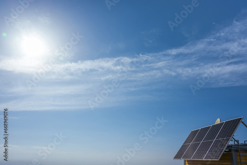 Photovoltaic modules on the roof of a house on a sunny day