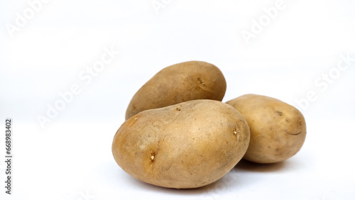 three potatoes on white background