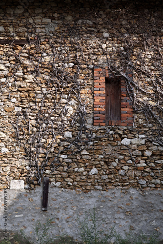 Old stone wall - village in Eure et Loire - Bleury - Saint Symphorien and Gallardon - France photo