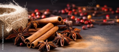 On board there are fragrant vanilla pods cinnamon sticks star anise and cloves for cooking or baking photo