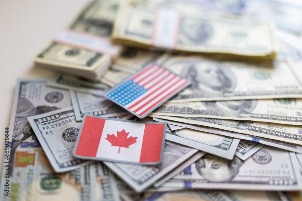 us and canadian flag on a us dollar background