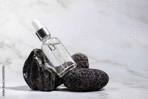 serum in vial on natural stone, facial moisturizing essence,anti aging,cosmetics for face