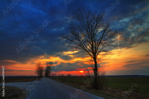 Landscape sundown in river valley  Poland Europe  amazing red sky and trees autumn time Poland Europe