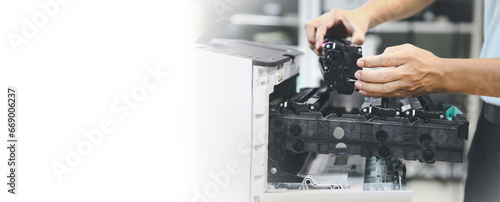 Technician hand open cover photocopier or photocopy to fix repair copier problem paper jam and replace ink cartridges for scanning fax or copy document in office workplace concept of service support. photo