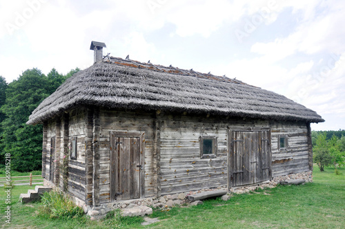 Authentic wooden barn with a thatched roof, Kosovo, Belarus.