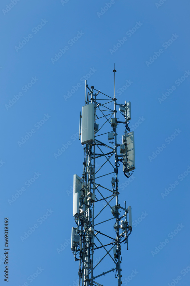 communication tower or 4G 5G network telephone cell site on blue sky and space for text. communication tower or 4G 5G network telephone cell site on blue sky and space for text.