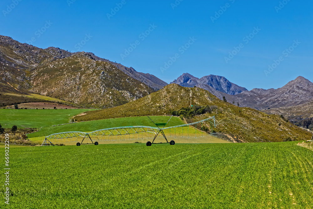 Fertile landscape of the remote Langkloof Valley in the Langeberg mountains with a center pivot irrigation in the Little Karoo, Western Cape, South Africa