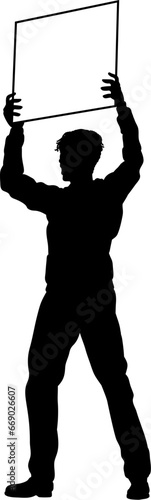 Protestor or demonstrator at a demonstration march, picket line or strike protest rally in silhouette. Holding up a banner or picket sign board placard.
