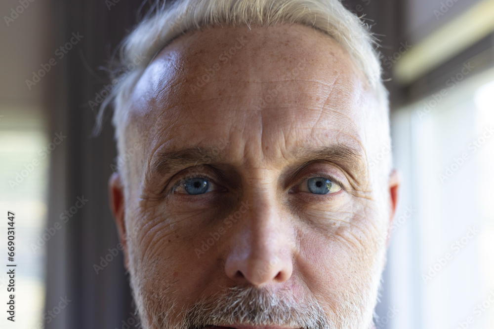 Portrait of happy senior caucasian man smiling at home Portrait of happy senior caucasian man smiling at home
