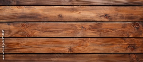 Brown wooden planks on a textured backdrop