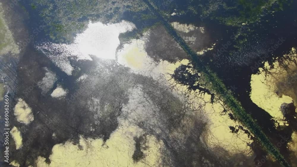 The flooded marshy area, with its wide expanse of water, the sunlight reflected, is a magical sight. Aerial view The flooded marshy area, with its wide expanse of water, the sunlight reflected, is a magical sight. Aerial view