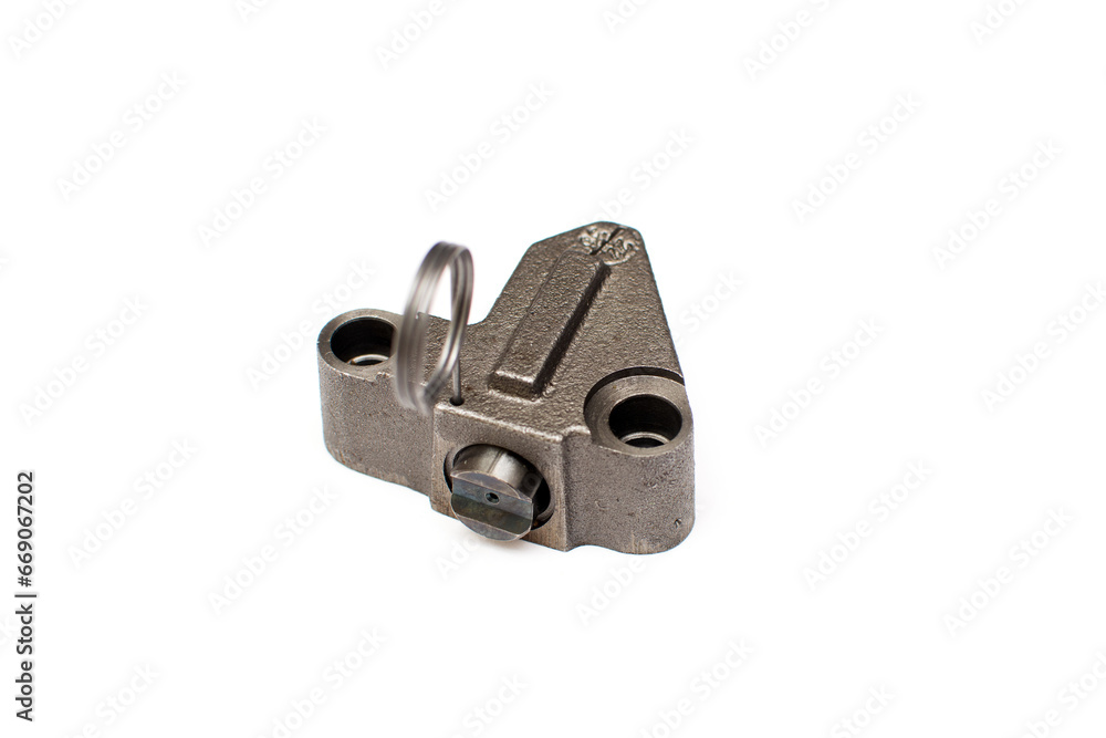 Timing chain tensioner isolated on a white background. New spare part. Timing chain tensioner isolated on a white background. New spare part.