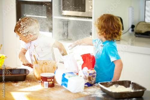 Canvas Print Brother, baking and flour with children fighting in the kitchen while making a mess of their home together