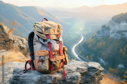 Close up of hiking backpack on stone in background of autumn mountains. Travel concept of vacation and holiday.