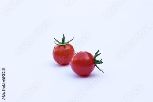Fresh red tomatoes on a white background © Semoga