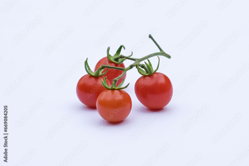 Fresh red tomatoes on a white background Fresh red tomatoes on a white background