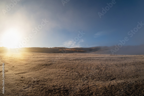 Sunny natural background  dawn over an autumn field  Copy space.