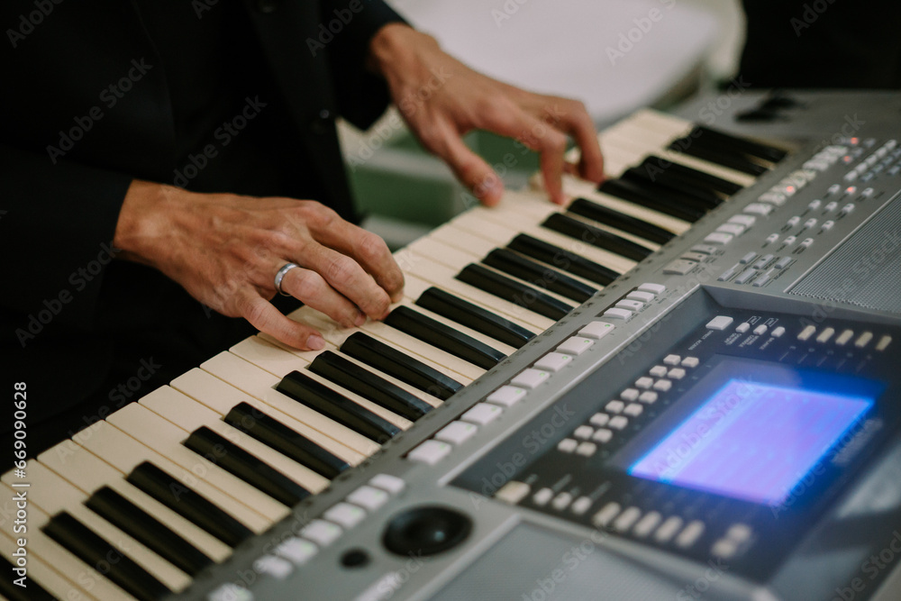 a person playing a keyboard sings his favorite song a person playing a keyboard sings his favorite song