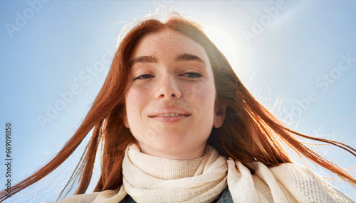 Close up portrait of young natural redhead with freckles and fresh look without makeup in autum