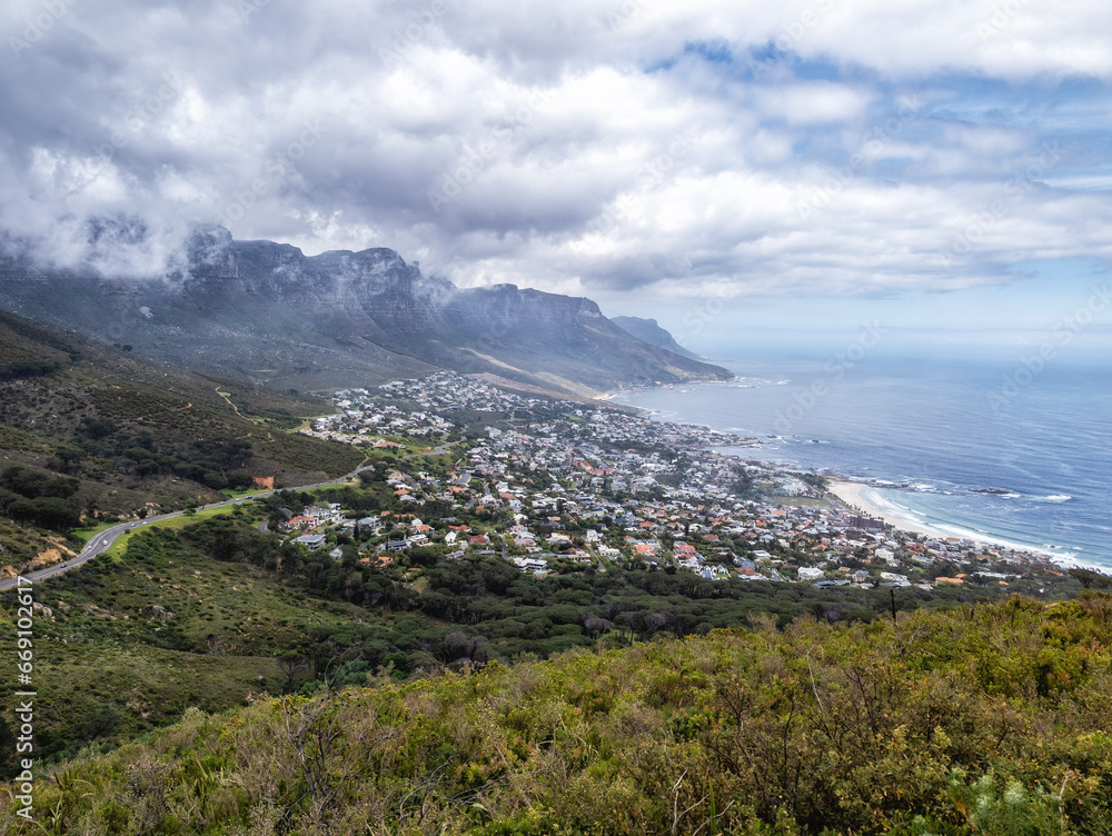 Aerial view of Camps Bay with the view of the Twelve Apostles mountain range.