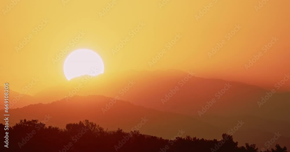 Sun Sunrise From Behind Mountains Time-lapse. Amazing Bold Golden Sunrise Gradient Sky Background. Natural Bright Dramatic Sky. Warm Yellow And Orange Colors. Sun Above Mediterranean Coast Of Turkey. Sun Sunrise From Behind Mountains Time-lapse. Amazing Bold Golden Sunrise Gradient Sky Background. Natural Bright Dramatic Sky. Warm Yellow And Orange Colors. Sun Above Mediterranean Coast Of Turkey.