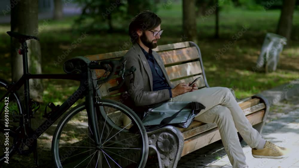 Man sitting bench with mobile phone overtime working outdoor Man sitting bench with mobile phone overtime working outdoor
