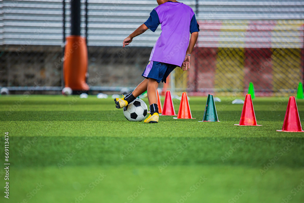 Obraz premium Children playing control soccer ball tactics on grass field with for training