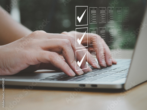 Quality inspection mark checklist document on business assurance, Businessman or quality document data inspector who is checking the validity of business quality guarantees and certifications.