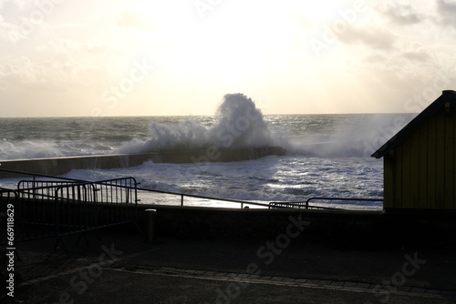 A big wave breaking on a jetty during a stormy day. Batz-sur-Mer  France - October 27th  2023.