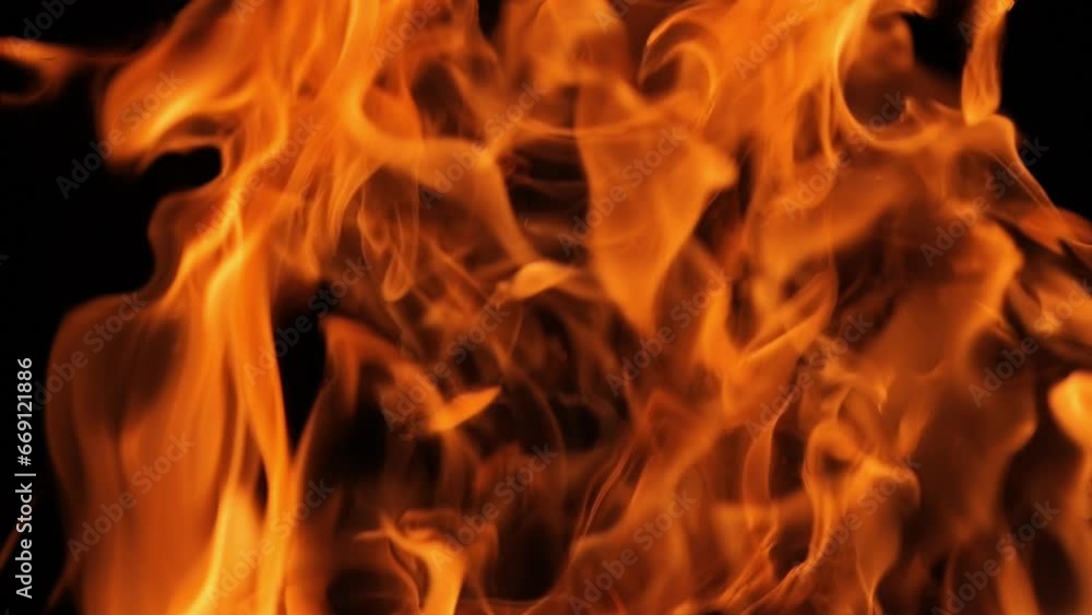 Flames and sparks of fire on a black background. A big bonfire. Fire and danger. Burning wood in the fireplace. Romantic fire. Fire at night. Flames and sparks of fire on a black background. A big bonfire. Fire and danger. Burning wood in the fireplace. Romantic fire. Fire at night.
