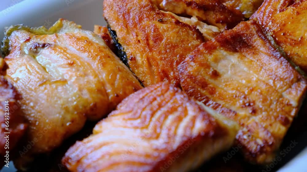 Stir-fried and sliced salmon fish in macro shot
Stir-fried and sliced salmon fish in macro shot