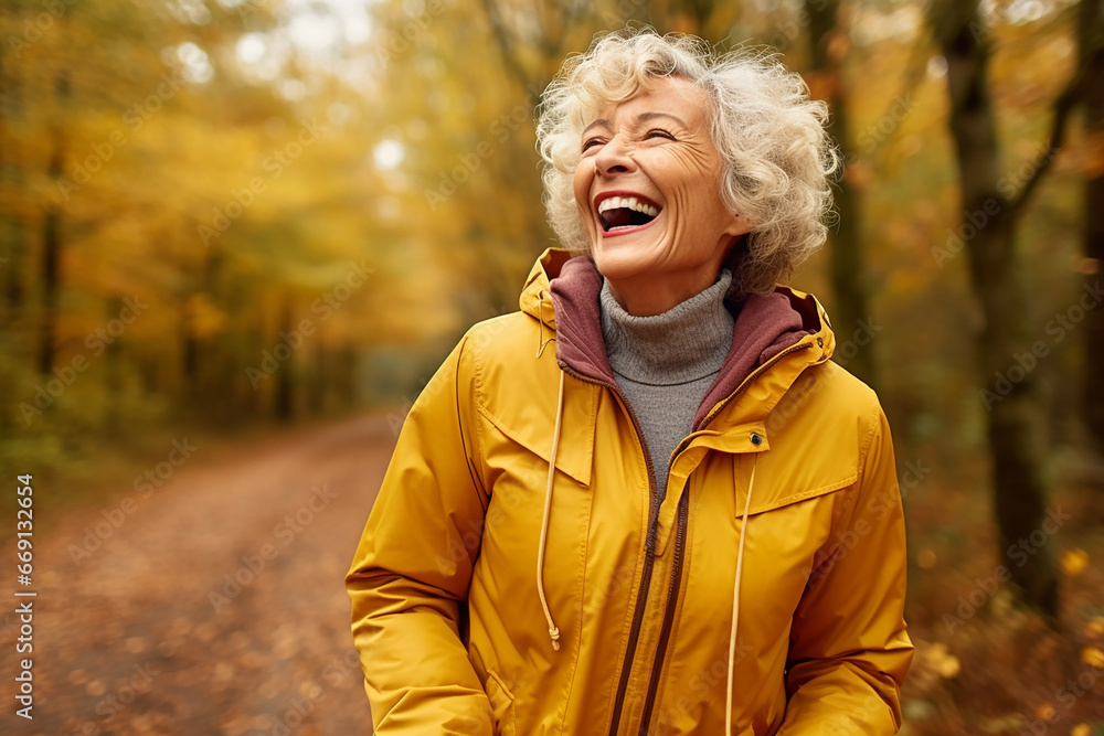The portrait of a happy mature woman in a warm autumn collection coat is walking along the path of the orange and yellow forest in autumn. Generative AI.