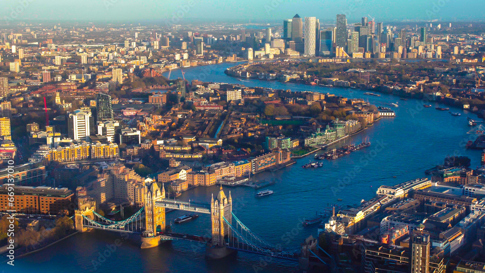 Aerial panoramic cityscape view of London and the River Thames, England, United Kingdom. Tower of London. anorama include river Thames, Tower bridge and City of London and Canary Wharf buildings. 
