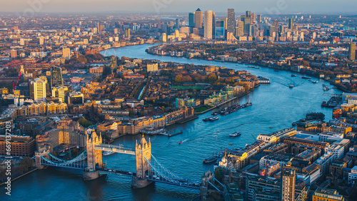 Aerial panoramic cityscape view of London and the River Thames, England, United Kingdom. Tower of London. anorama include river Thames, Tower bridge and City of London and Canary Wharf buildings.  photo