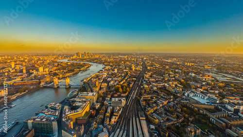 Aerial panoramic cityscape view of London and the River Thames, England, United Kingdom. Tower of London. anorama include river Thames, Tower bridge and City of London and Canary Wharf buildings. 