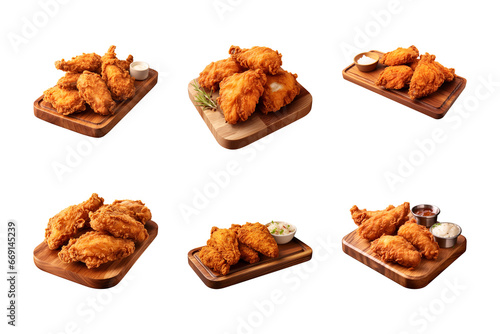 collection of crispy and tasty fried chicken on a wooden cutting board isolated on a transparent background