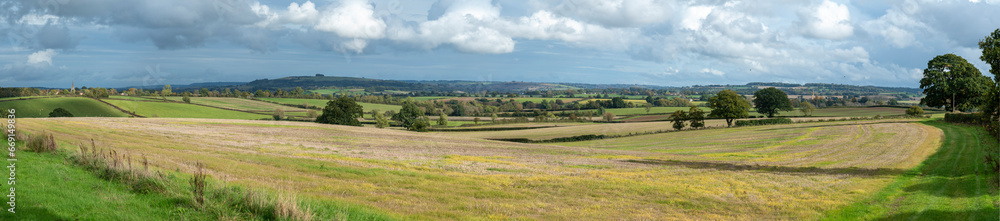 Wide panorama of beautiful Cotswold landscape on a sunny autumn day with  a long vista. English countryside