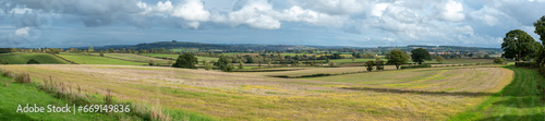 Wide panorama of beautiful Cotswold landscape on a sunny autumn day with  a long vista. English countryside