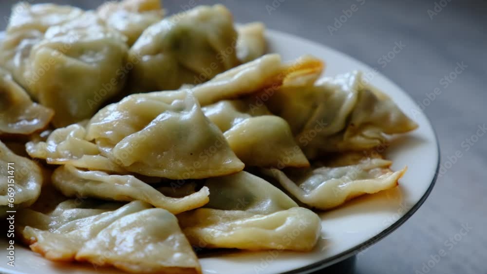 Serving Gyoza dumplings, a local Chinese and Japanese common food Serving Gyoza dumplings, a local Chinese and Japanese common food