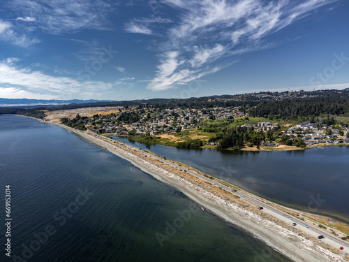Esquimalt lagoon aerial looking towards Royal bay new development and the Olympic Mountains in Washington USA on Vancouver Island Canada. photo
