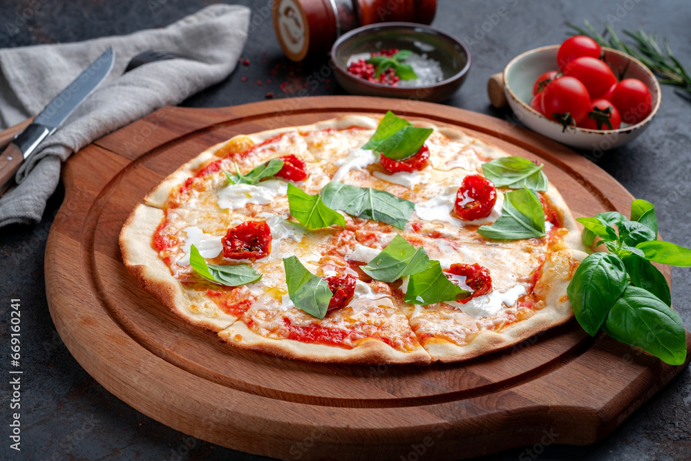Pizza with strachatella, dried tomatoes and fresh basil. Italian pizza with Stracciatella cheese Pizza with strachatella, dried tomatoes and fresh basil. Italian pizza with Stracciatella cheese