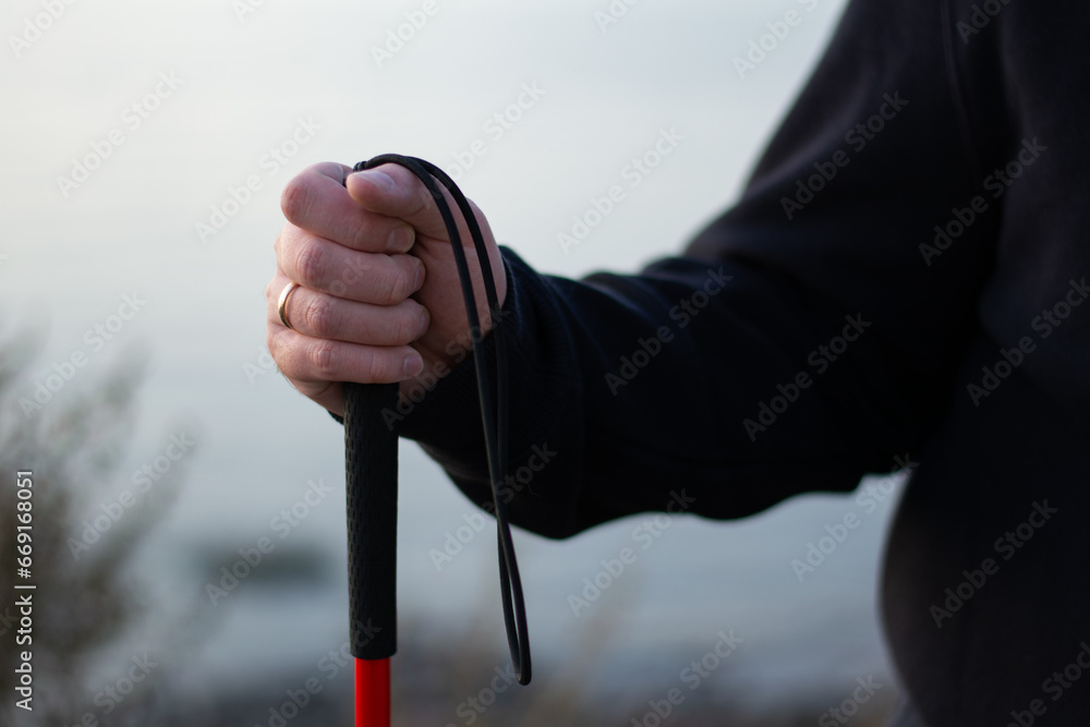 blind person holding a walking stick