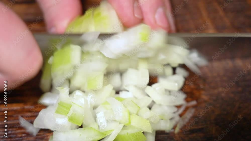 Chef cutting the onion at cutting board. Chef cutting the onion at cutting board.