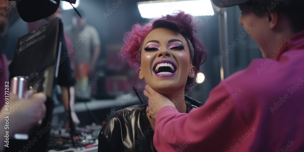 A woman with pink hair is getting her make-up done. This image can be used for beauty and fashion related content A woman with pink hair is getting her make-up done. This image can be used for beauty and fashion related content