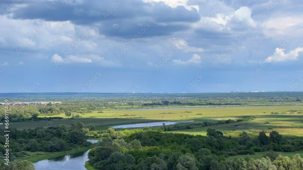 Picturesque view of the Kama River from the observation deck at the Yelabuga settlement. The movement of clouds over the river. Lower Kama National Park. Yelabuga, Republic of Tatarstan, Russia, 4K Picturesque view of the Kama River from the observation deck at the Yelabuga settlement. The movement of clouds over the river. Lower Kama National Park. Yelabuga, Republic of Tatarstan, Russia, 4K
