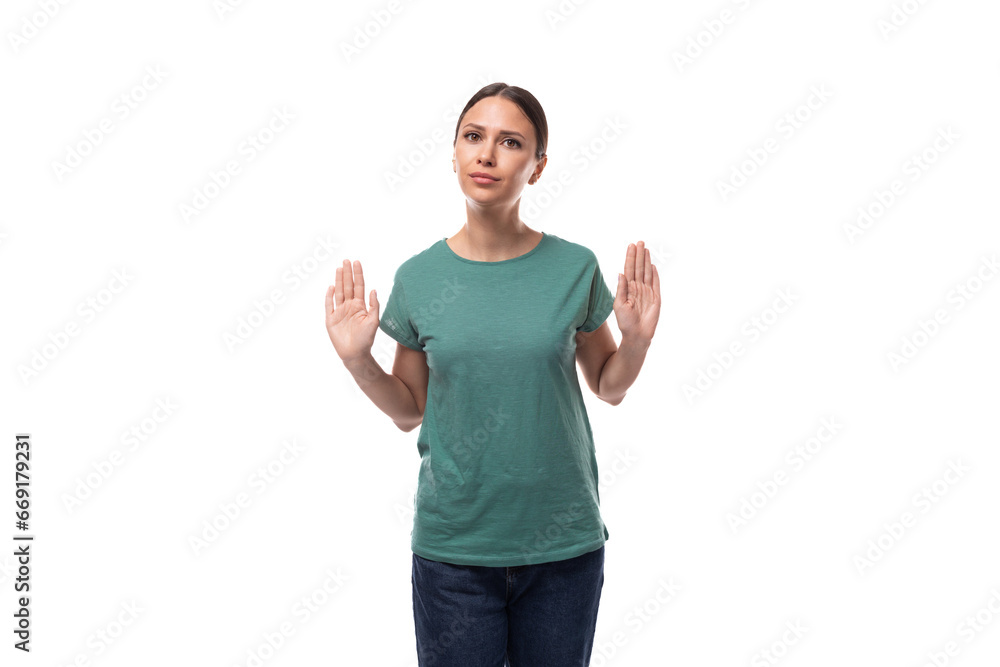 young brunette woman thinking while standing alone young brunette woman thinking while standing alone