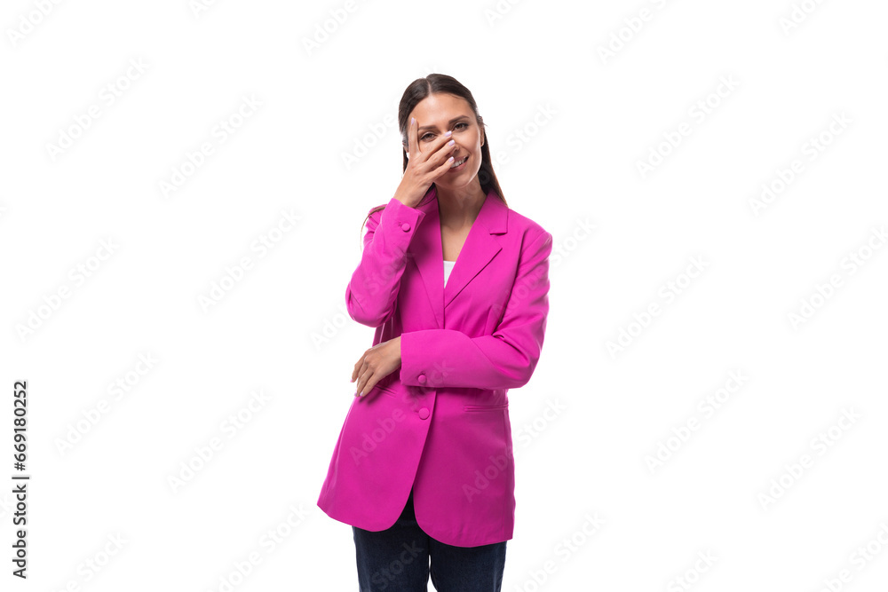 young brunette business woman dressed in a crimson chic suit on a white background with copy space young brunette business woman dressed in a crimson chic suit on a white background with copy space