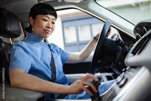 Hospital nurse confidently navigating her way to her next shift photo