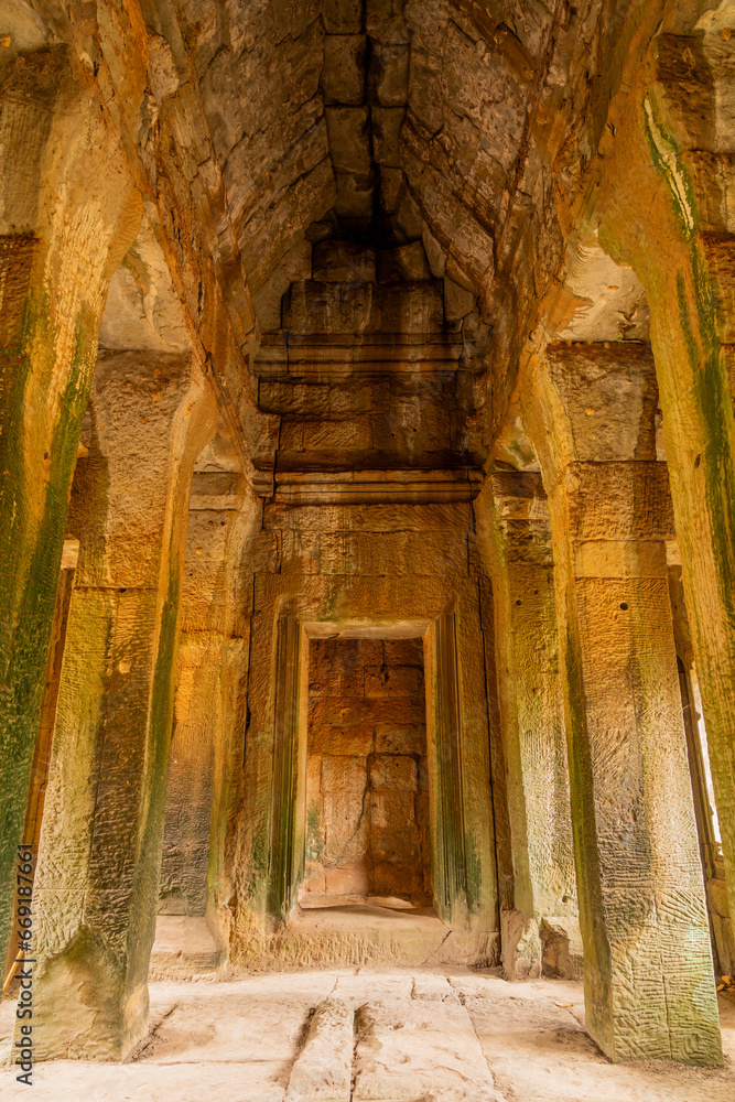 Vault and columns in one of the temples of the mysterious city of Angkor in Cambodia. Vault and columns in one of the temples of the mysterious city of Angkor in Cambodia.